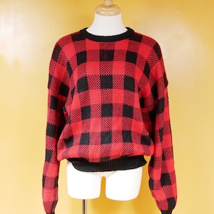 Pull ample en damier rouge et noir