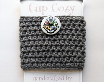 Coffee Cup Cozy - charcoal grey with Harry Potter Hogwarts crest - soft, hand-crocheted, reusable sleeve for hot/cold beverages