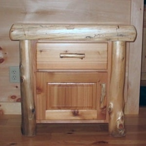 May include: A rustic wooden nightstand with a single drawer and a cabinet door. The nightstand is made of natural wood with a rough-hewn finish.