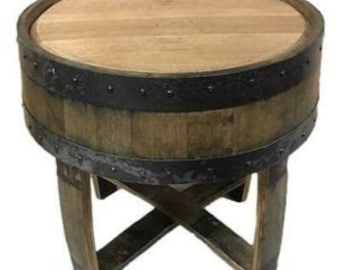 May include: A rustic wooden barrel side table with a round top and a dark metal band. The table has a natural wood finish and a cross-legged base. The table is approximately 24 inches tall.