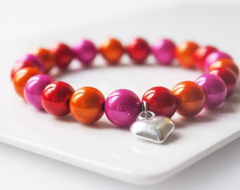 Magic Armband pink orange rot miracle beads schimmer Perlenarmband glänzend mit Herz Charm Buddha