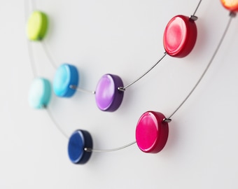 rainbow necklace with polaris coins in rainbow colors