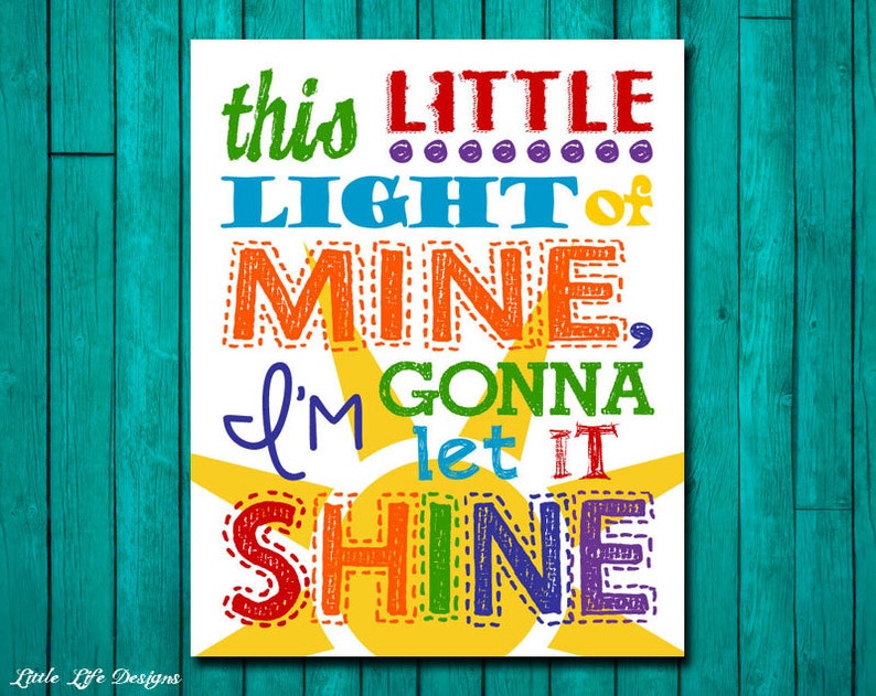 May include: A colorful print with a yellow sun and the text "this LITTLE LIGHT of MINE, I'M GONNA let IT SHINE".