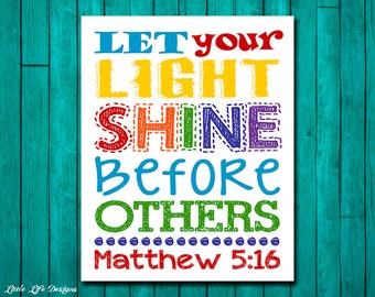 May include: A white printable sign with the text "Let your light shine before others Matthew 5:16" in colorful, outlined letters.