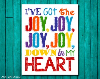 May include: A white printable wall art design with the text "I'VE GOT the JOY, JOY, JOY, JOY, DOWN in MY HEART" in colorful, rainbow-colored letters.