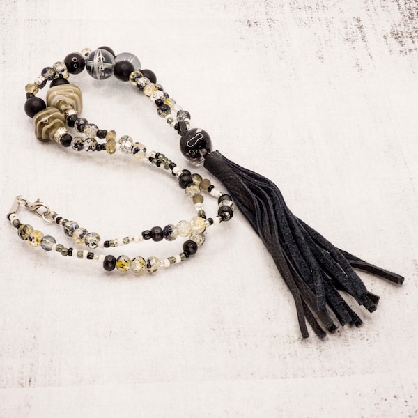 Long beaded necklace with leather tassel in white and black for women