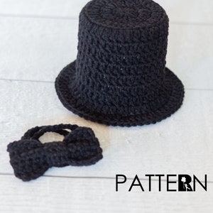 May include: A black crochet top hat and bow tie set. The top hat has a cylindrical crown and a wide brim. The bow tie is a small, knotted design. The word "PATTERN" is printed in black.