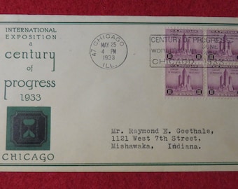 May include: A vintage envelope with a green and black hourglass graphic and the text "INTERNATIONAL EXPOSITION a century of progress 1933 CHICAGO". The envelope has four purple stamps with the text "CENTURY OF PROGRESS WORLD'S FAIR JUNE 1933 CHICAGO" and a postmark from Chicago, Illinois dated May 25, 1933.
