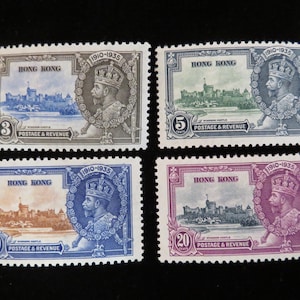 May include: Four vintage Hong Kong postage stamps featuring a portrait of King George V and Windsor Castle. The stamps are in denominations of 3, 5, 10, and 20 cents. The stamps are printed in shades of blue, green, and purple.