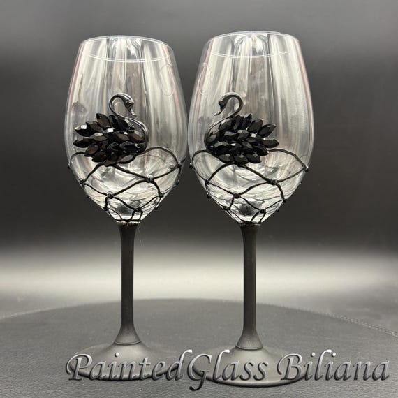 Black swan toasting wine glasses