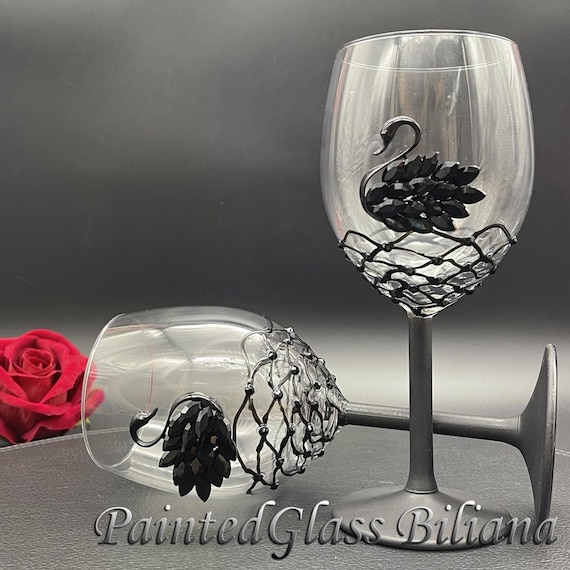 Black swan toasting wine glasses