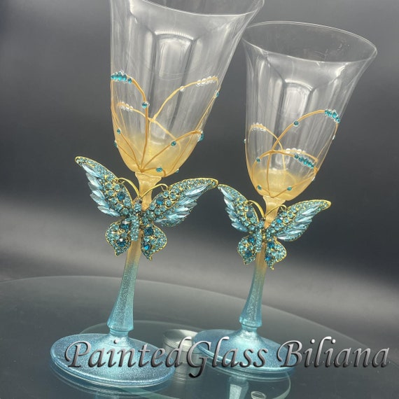 Blue butterflies toasting wine glasses