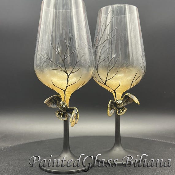 Black gold owl toasting wine glasses