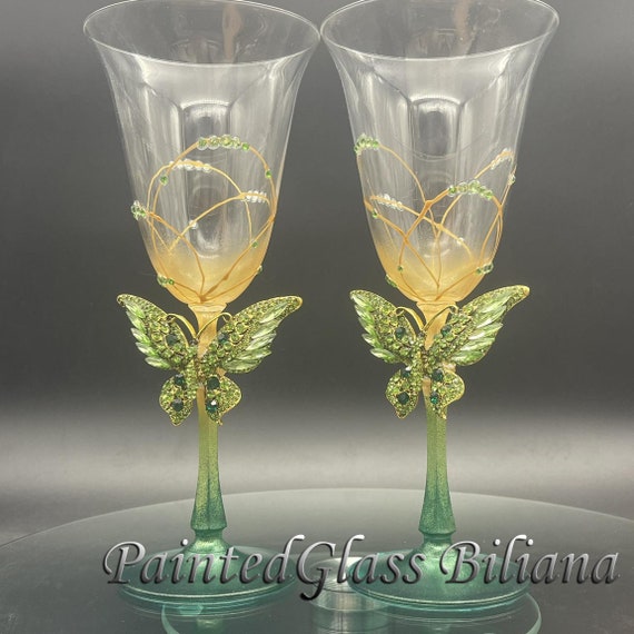 Green butterflies toasting wine glasses