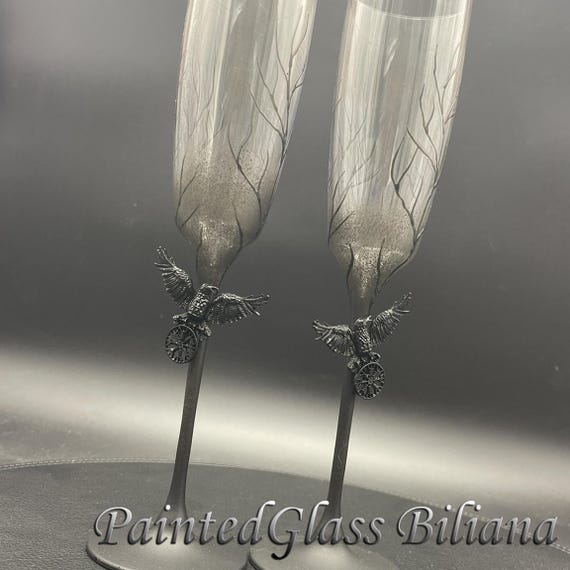 Black raven toasting wedding flutes