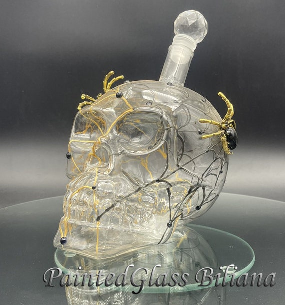 Gold black spider web skull bottle
