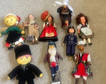 Vintage lot of 9 dolls from around the world.