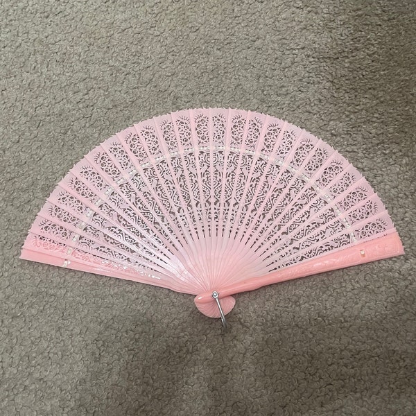 Hand Fan, Pink plastic with metal ring on bottom