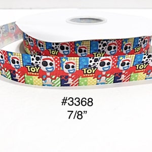 May include: A roll of ribbon featuring a repeating pattern of a cartoon character with a white face, red hair, and a blue and white spotted design. The ribbon is 7/8" wide and has the text "TOY STORY". The product code is #3368.