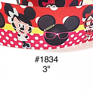 May include: Red ribbon with white polka dots and cartoon Minnie Mouse characters wearing glasses. The ribbon has a yellow stripe and the text "#1834" and "3" printed on it.