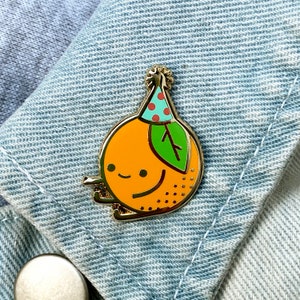 Lil Orange Enamel Pin · A Lil Buddies Pin · Orange Fruit, Party Hat · Shiny Flair Lapel Pin