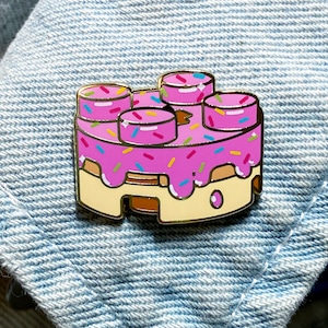 Pink Donut Enamel Pin · Building Block Shaped Food · &quot;Stackable Snacks&quot; · Shiny Flair Lapel Pin