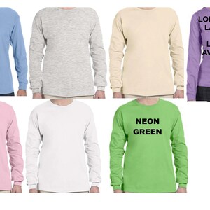 May include: A set of long-sleeve t-shirts in various colors, including light blue, gray, beige, pink, white, and neon green. Some shirts have text printed on them, such as "NEON GREEN" and "LONG SLEEVE LAVENDER NO LONGER AVAILABLE".
