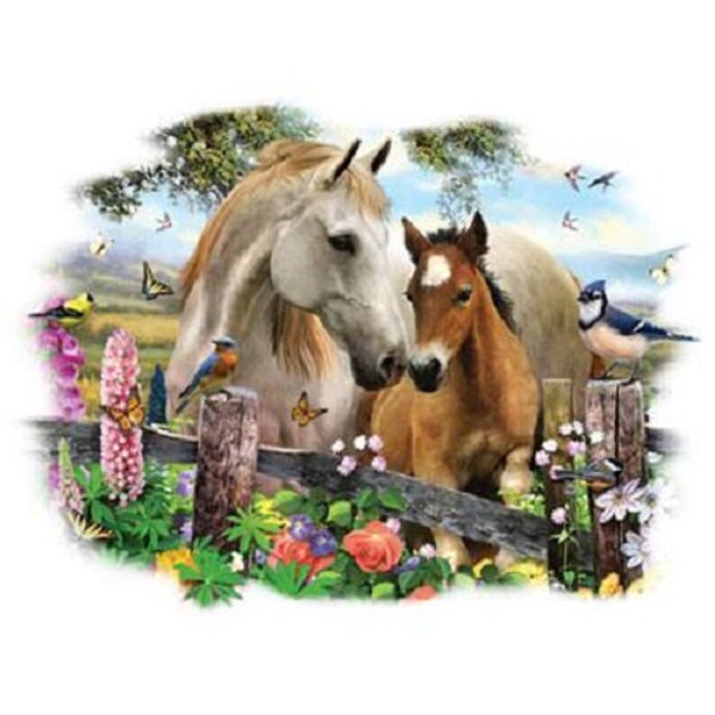 May include: A white horse and a brown foal stand side-by-side, nuzzling each other. They are in a field with a wooden fence and colorful flowers. There are also several birds and butterflies in the image.