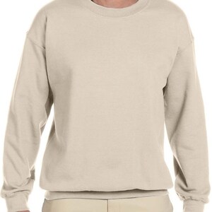 May include: A plain, light beige sweatshirt with long sleeves and a crew neck.