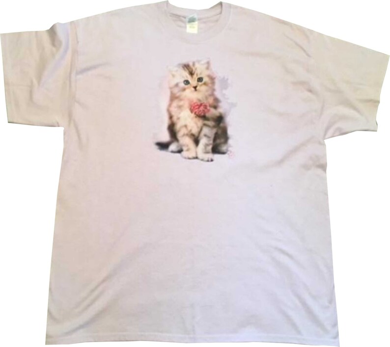 May include: A lavender t-shirt with a graphic of a cute kitten holding a pink ball of yarn.