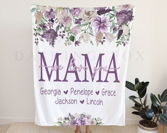 May include: White fleece blanket with a floral design in shades of purple and white. The text "Mama we love you" is printed in purple with the names "Georgia, Penelope, Grace, Jackson, Lincoln" printed below.