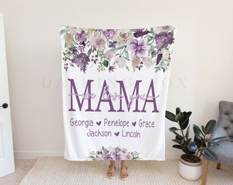 May include: White fleece blanket with a floral design in shades of purple and white. The text "Mama we love you" is printed in purple with the names "Georgia, Penelope, Grace, Jackson, Lincoln" printed below.