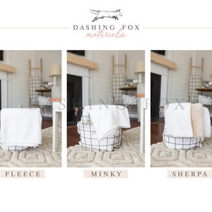 May include: Three white blankets in wire baskets, labeled "Fleece", "Minky", and "Sherpa".  The blankets are folded and displayed in a cozy living room setting.