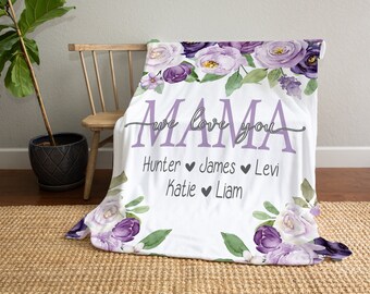 May include: White fleece blanket with purple floral design and the text "Mama we love you" with names Hunter, James, Levi, Katie, and Liam.