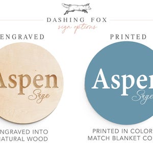 two options for a sign: an engraved wooden sign and a printed sign. The engraved sign is made of natural wood and has the word "Aspen Sage" carved into it, while the printed sign is a circle with the word "Aspen Sage" printed on it. The engraved sign is described as "ENRAGED into NATURAL WOOD" and the printed sign is described as "PRINTED in COLOR to MATCH BLANKET COLORS".