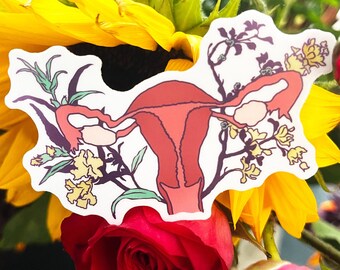 May include: A sticker of a uterus with flowers and leaves surrounding it. The uterus is red and the flowers are yellow. The sticker is on a background of yellow sunflowers and red roses.