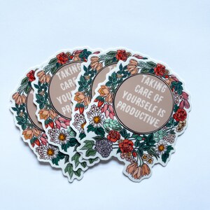 May include: A set of four floral stickers with the text "Taking care of yourself is productive." The stickers are round and feature a variety of flowers in shades of pink, red, green, and white.