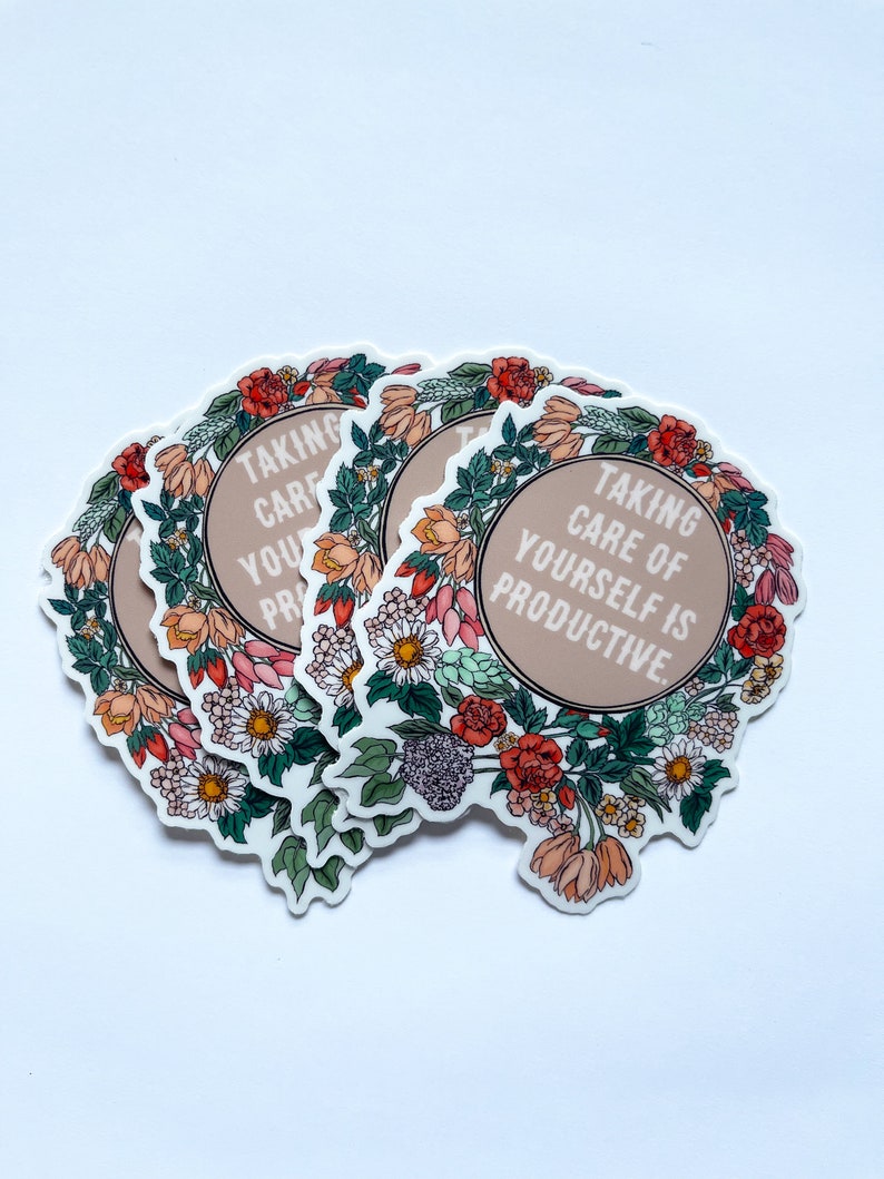 May include: A set of four floral stickers with the text "Taking care of yourself is productive." The stickers are round and feature a variety of flowers in shades of pink, red, green, and white.