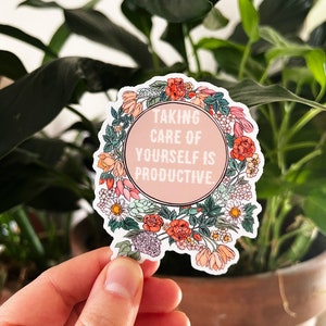 May include: A pink and white sticker with a floral border and the text "Taking care of yourself is productive."