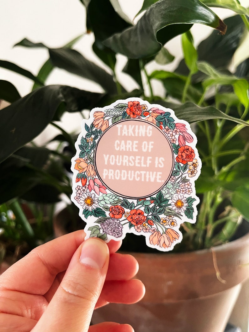 May include: A pink and white sticker with a floral border and the text "Taking care of yourself is productive."