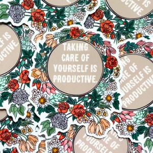 May include: A set of stickers featuring a floral design and the text "Taking care of yourself is productive." The stickers are printed on white paper with a brown background.