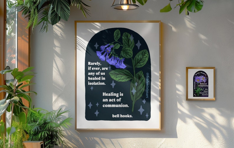 May include: A dark blue poster with a quote by bell hooks about healing and community. The quote reads "Rarely, if ever, are any of us healed in isolation. Healing is an act of communion. bell hooks." The poster features a stylized illustration of a purple flower with green leaves.