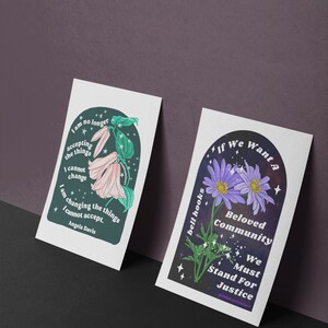 May include: Two printable art prints with inspirational quotes and floral illustrations. The first print features a pink flower with green leaves and the quote "I am no longer accepting the things I cannot change. I am changing the things I cannot accept. - Angela Davis". The second print features a purple flower with green leaves and the quote "If we want a beloved community, we must stand for justice. - bell hooks #prahfeministart".