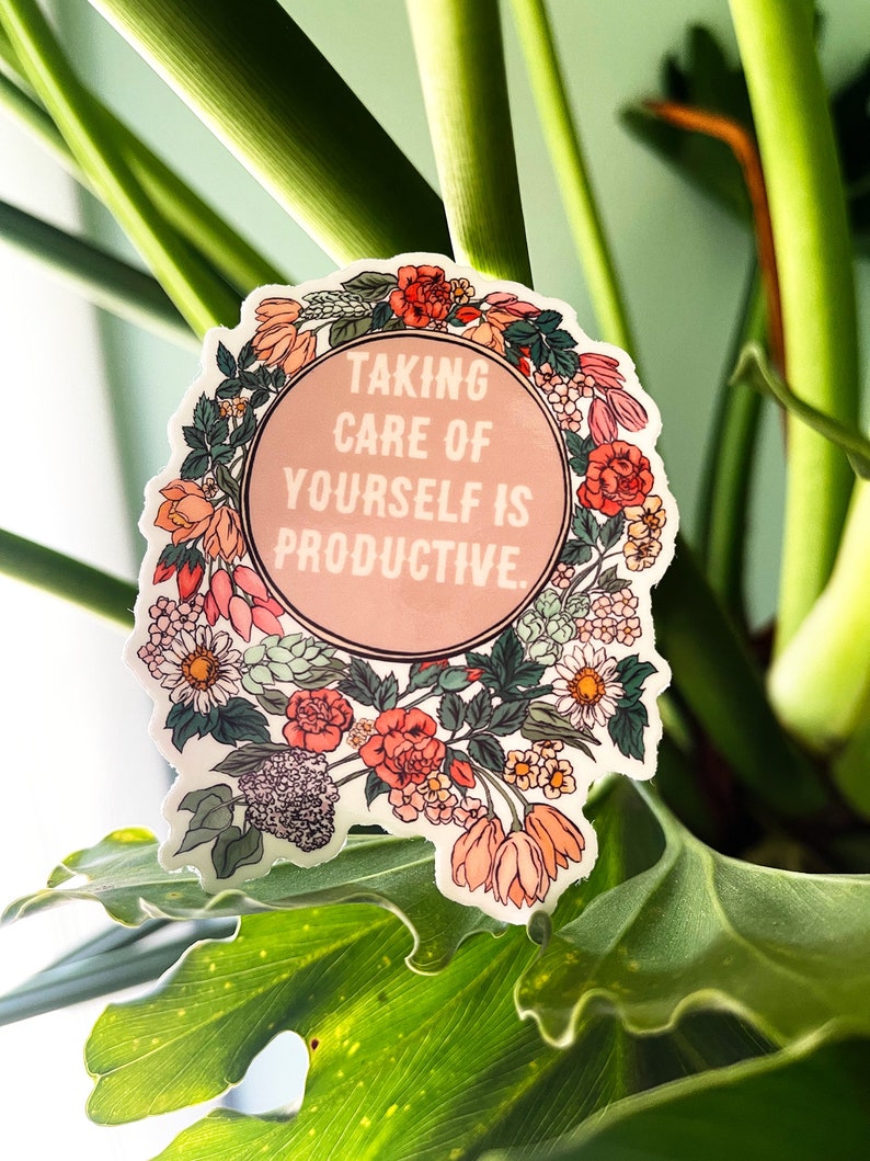 May include: A pink and white sticker with a floral border and the text "Taking care of yourself is productive."