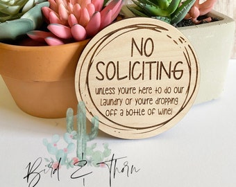 No Soliciting, small sign, for door, or above doorbell, do our laundry or a bottle of wine