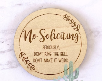 No Soliciting, small sign, for door, or above doorbell, don't make it weird