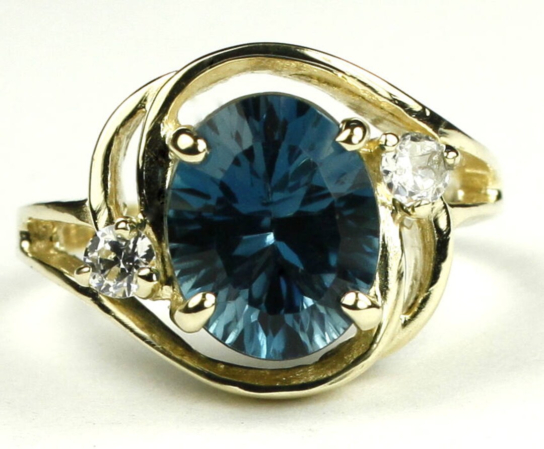 18k gold ring with big ass blue topaz