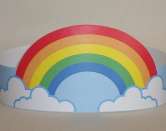 May include: A white paper headband with a rainbow and clouds design. The rainbow has red, orange, yellow, green, blue, and purple stripes. The clouds are white with blue outlines.