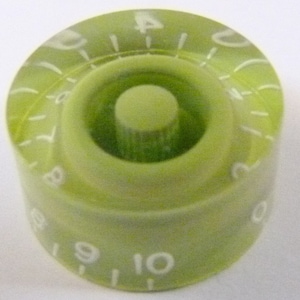 Pode incluir: Uma maçaneta de plástico verde com números brancos de 0 a 10 impressos ao redor da borda. A maçaneta tem uma parte superior de plástico transparente e um centro branco.