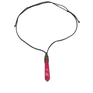 May include: A pink and white agate stone pendant on a brown cord necklace. The pendant has a gold-toned metal cap.